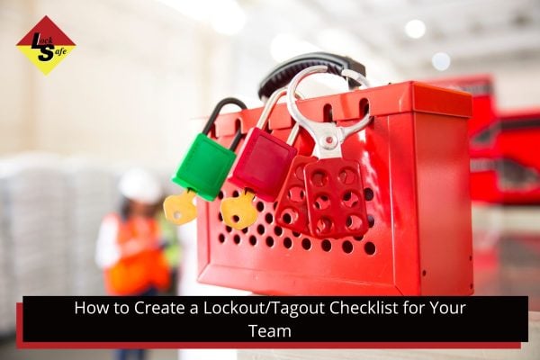 A red lockout box with multiple colored padlocks and tags attached, with a blurred background of a factory setting.